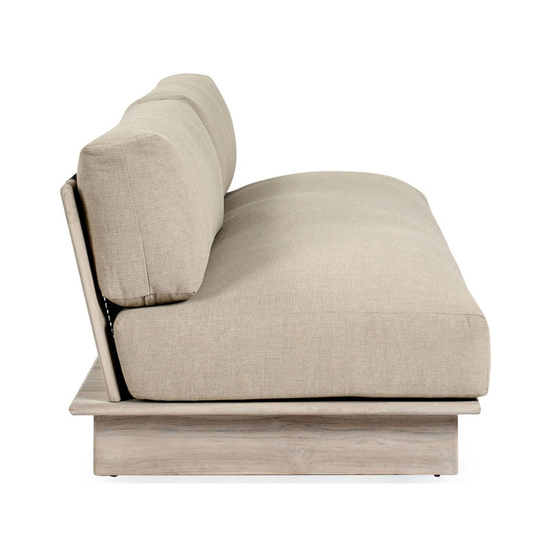 Outdoor sofa with taupe chaise seat and teak side frame
