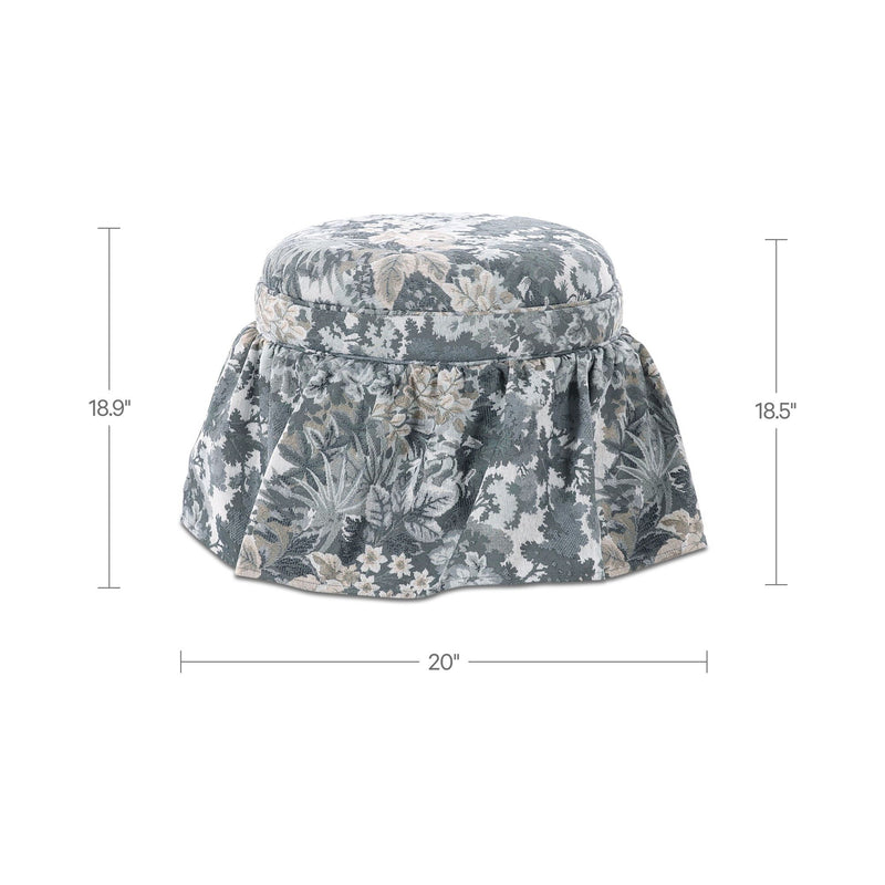 Round storage ottoman with blue-gray botanical tapestry and padded top