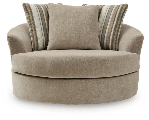 Oversized swivel accent chair in light beige fabric with two striped back cushions