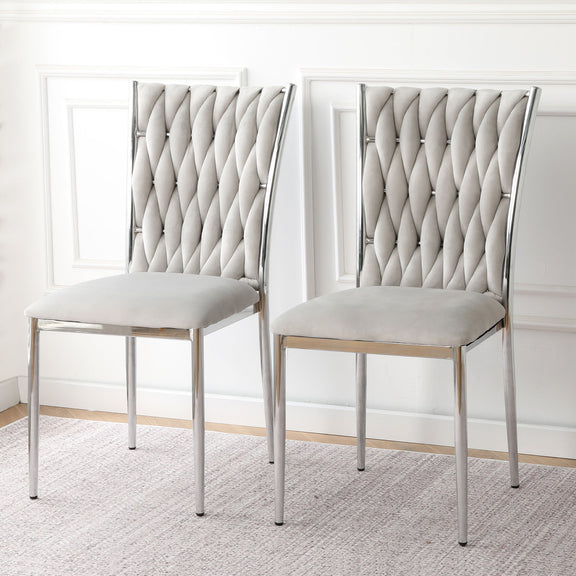 Pair of ivory tufted dining chairs with diamond back and chrome legs