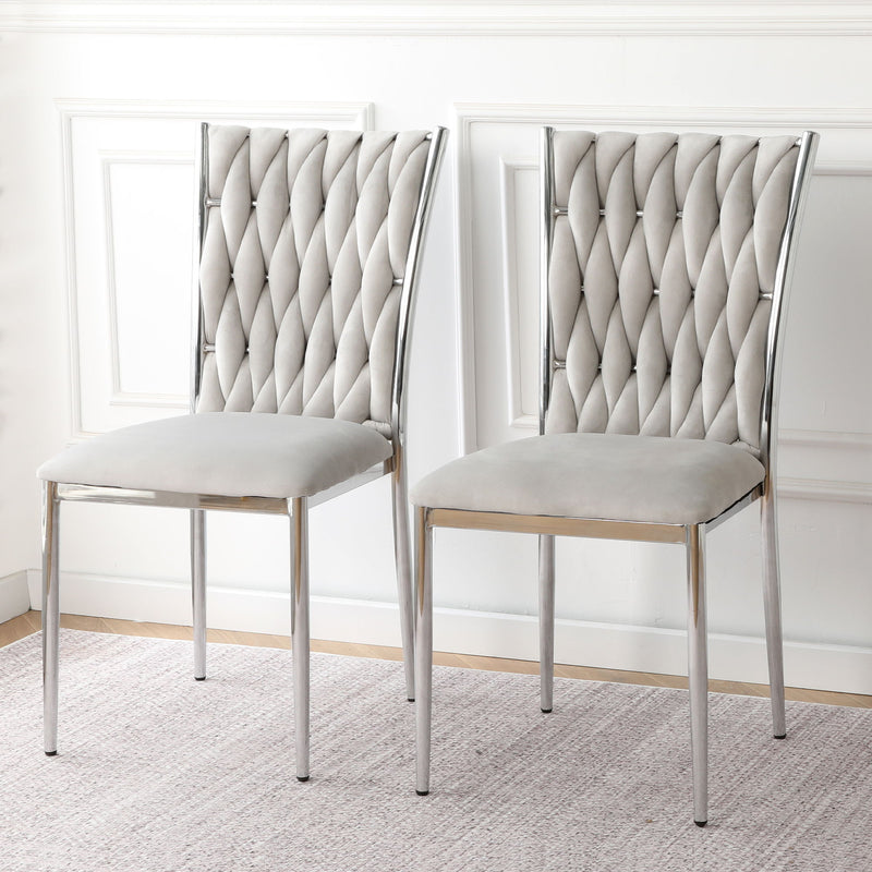 Pair of ivory tufted dining chairs with diamond back and chrome legs