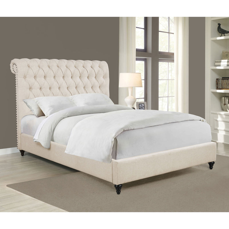 Beige tufted upholstered bed with rolled back headboard, fabric side rails, dark feet