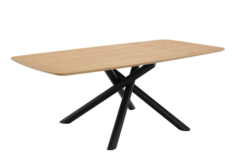 Light wood dining table with black X-style legs, angled view