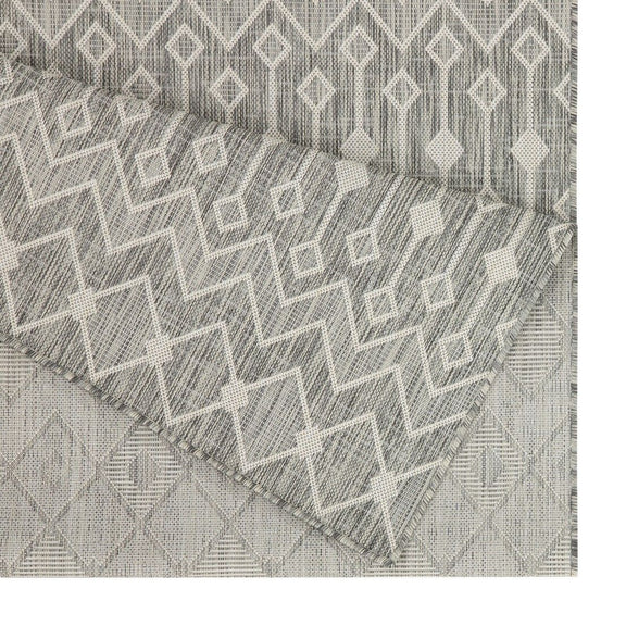 Indoor/outdoor polypropylene area rug, light gray with white geometric lattice pattern.