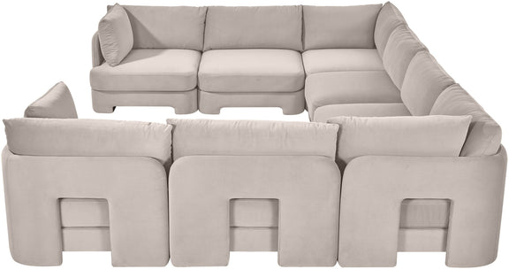 Light gray velvet U-shaped sectional sofa with padded arms and front panel cutouts