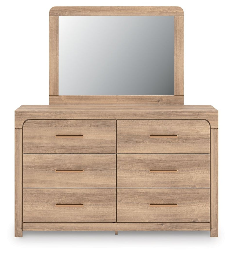 Tan dresser with arched mirror, six drawers and long gold bar handles