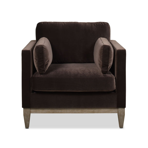 Dark upholstered armchair with padded back, rounded armrests, and light wood legs.