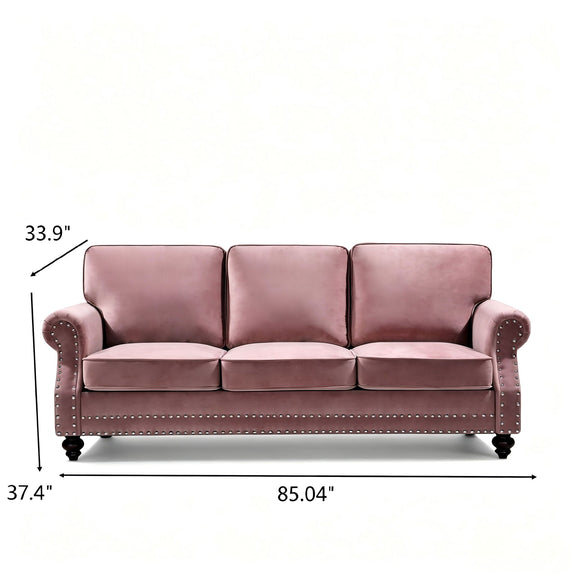 Pink 3-seat sofa with nailhead trim and turned legs, front view