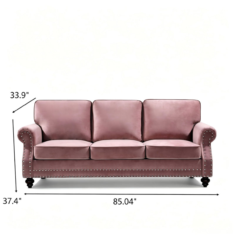 Pink 3-seat sofa with nailhead trim and turned legs, front view