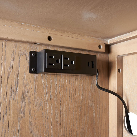 Wood cabinet power outlet module with black plate and cord opening