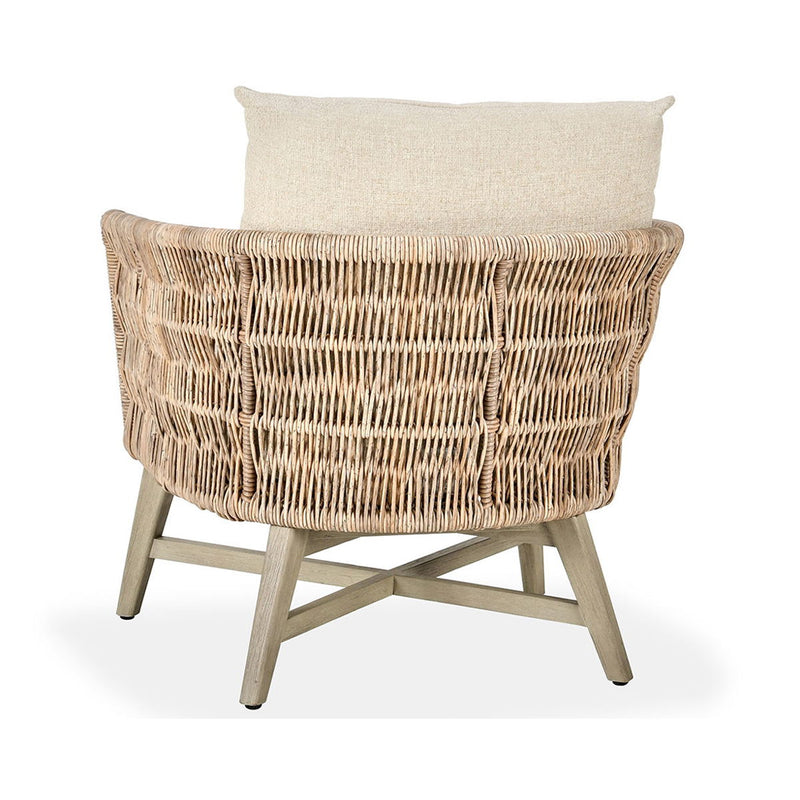 Outdoor accent chair back view with woven rattan pattern and tall sand cushion