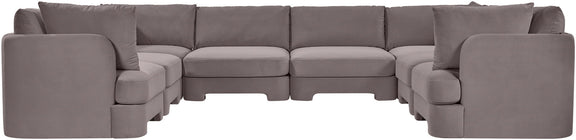 Gray velvet U-shaped sectional sofa with rounded arm sections and multiple seat modules