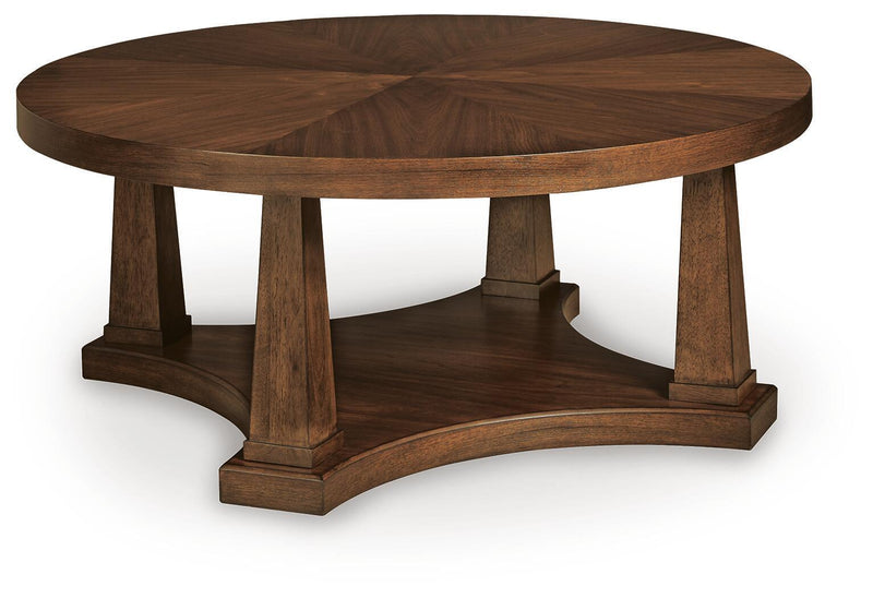 Round wooden end table with lower shelf and four tapered legs