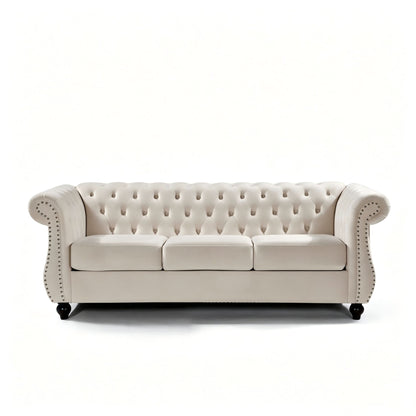 Beige three-seat button-tufted sofa with rolled arms and nail-trimmed edges