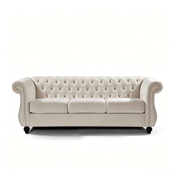 Beige three-seat button-tufted sofa with rolled arms and nail-trimmed edges