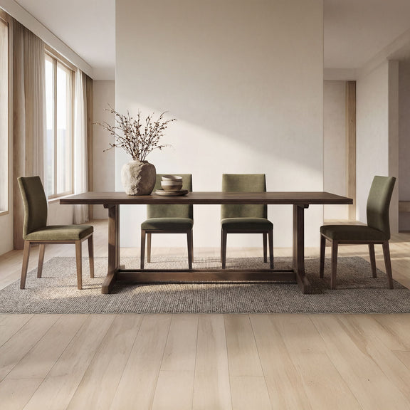 Olive upholstered dining chairs with wooden legs in a dining seating arrangement