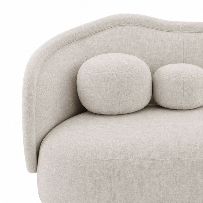 Light gray textured velvet sofa with curved arms, rounded back bolster pillows