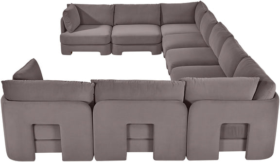 Gray velvet performance fabric sectional sofa section with tufted seat cushions and arm panels