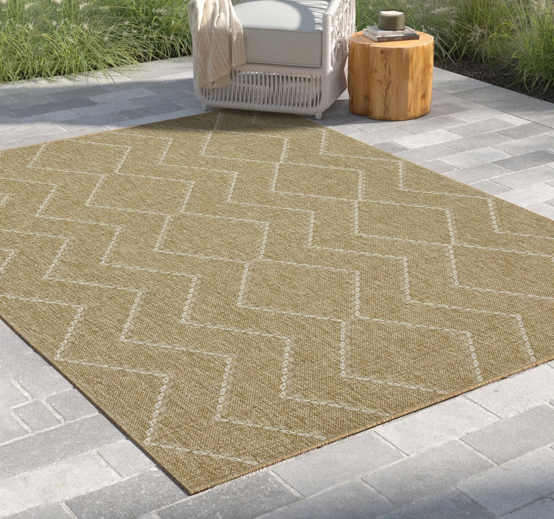 Light brown jute area rug with geometric lattice pattern, indoor/outdoor style.