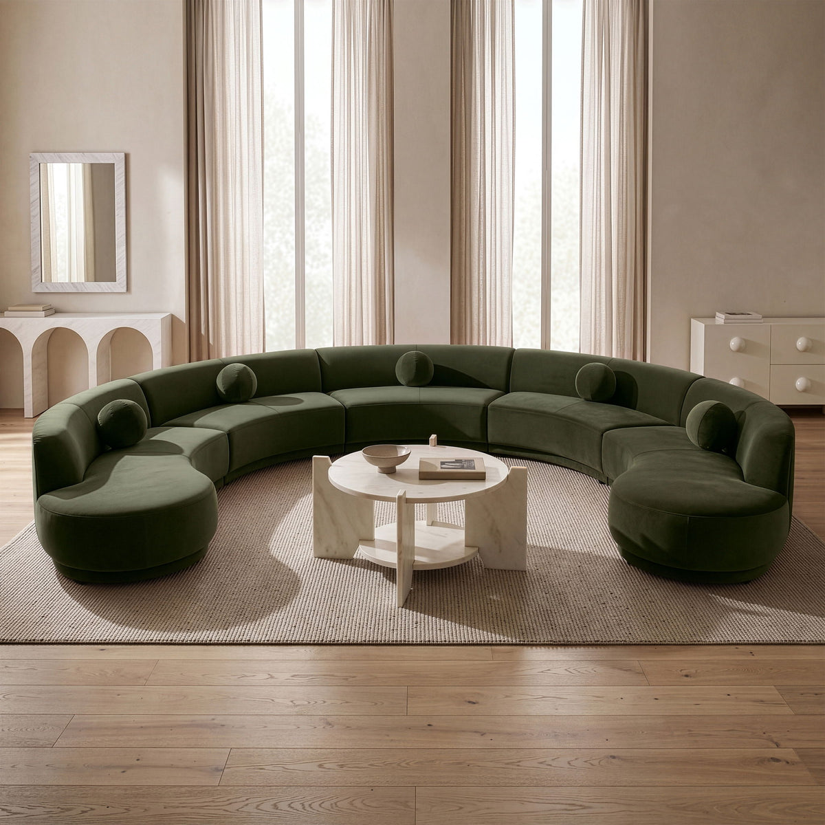 Green performance velvet sectional sofa with rounded ottoman-style sections and bolsters