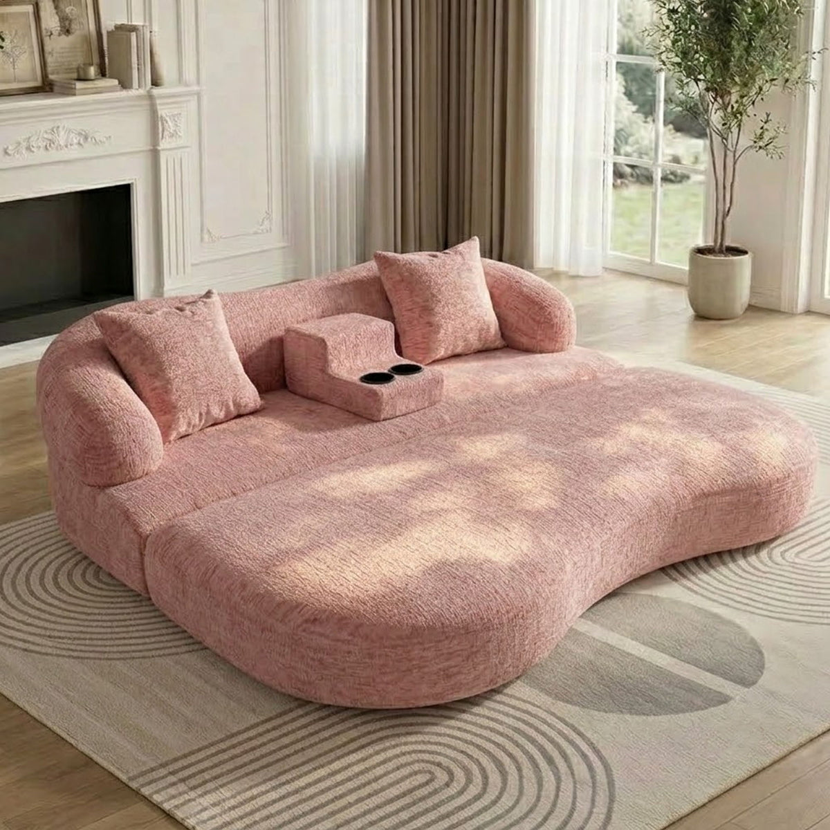 Pink convertible sleeper sofa bed in bed position with center cup holder