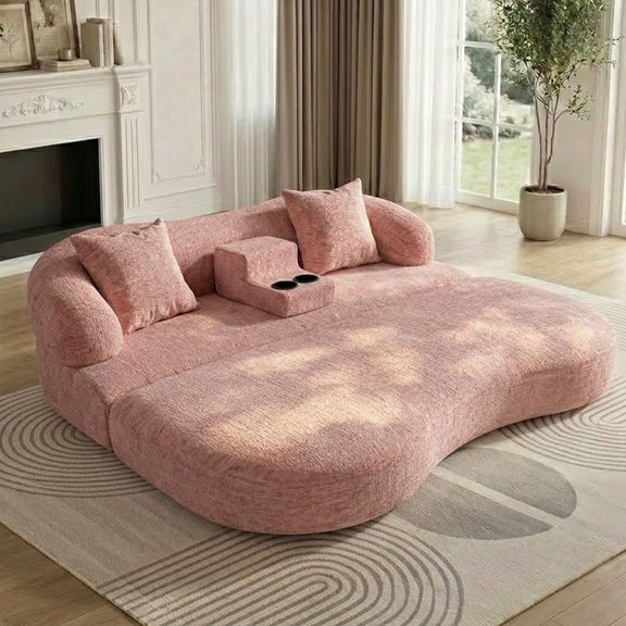 Pink convertible sleeper sofa bed in bed position with center cup holder