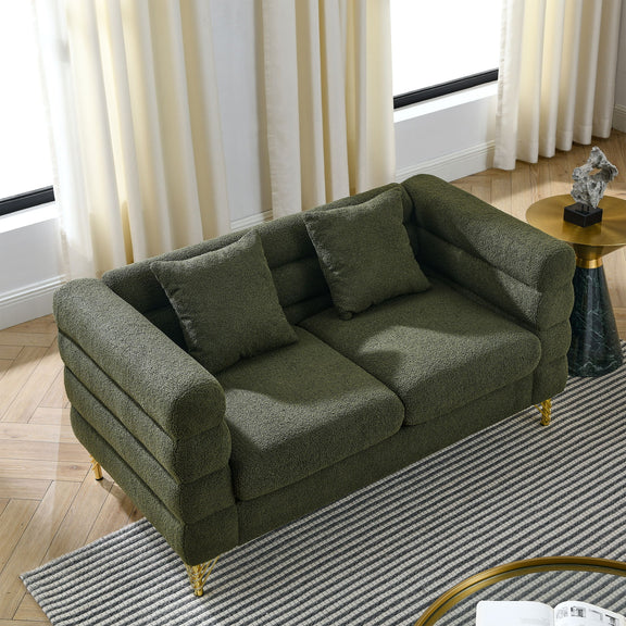 Dark green sectional sofa viewed from the side, with three seat cushions and gold legs.