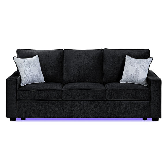 Dark gray upholstered 3-seat sofa with 2 patterned throw pillows and LED base light