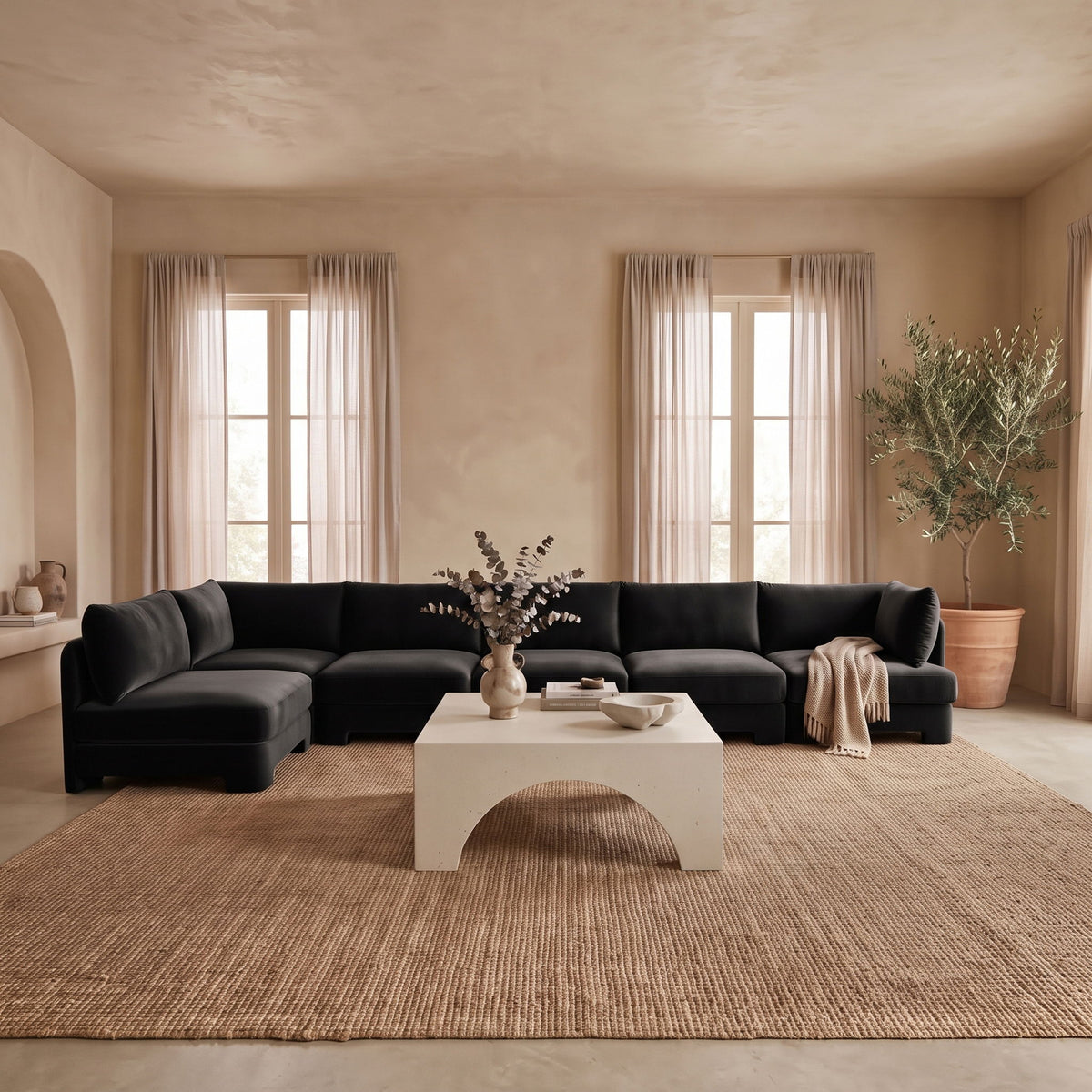 Black L-shaped armless sectional sofa with velvet-look upholstery and chaise corner