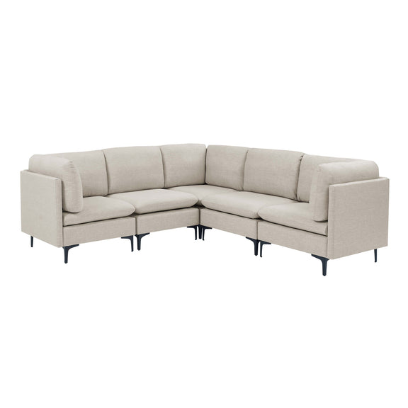 Beige modular sectional sofa with tall dark legs and angled corner layout