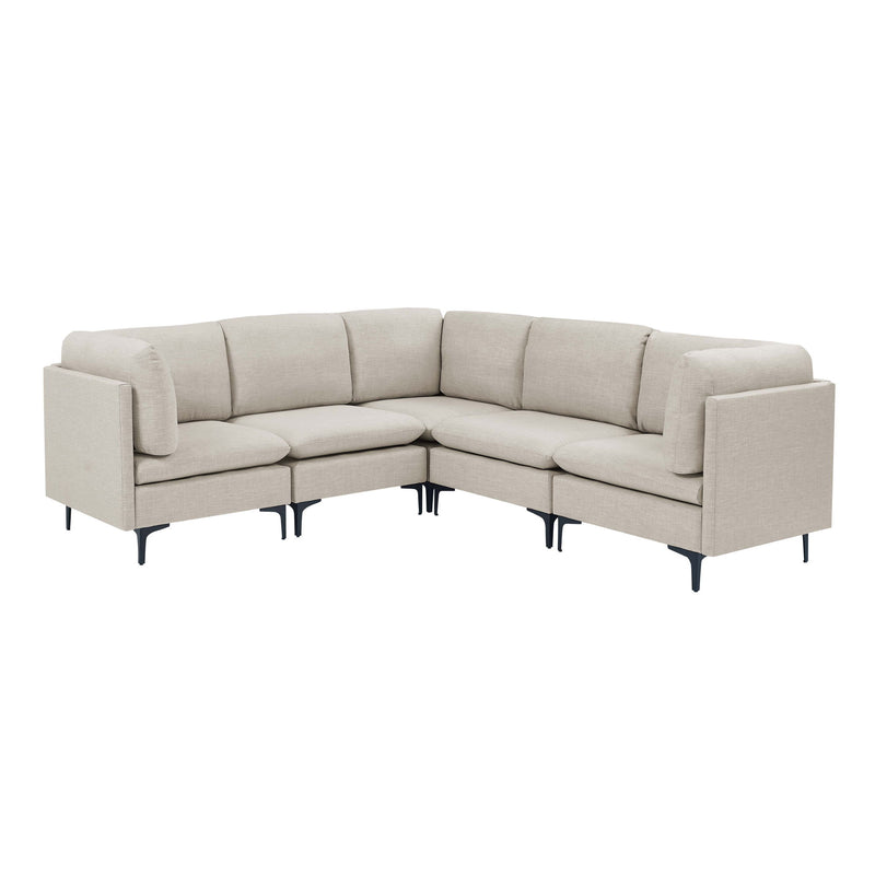 Beige modular sectional sofa with tall dark legs and angled corner layout