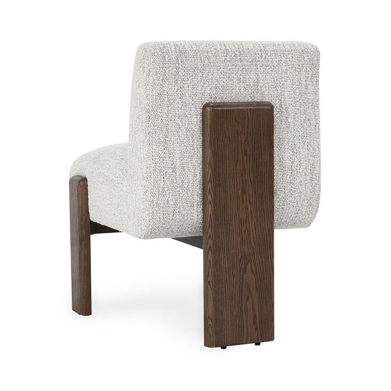 Upholstered dining chair in pixel ivory with visible side profile and dark wood frame