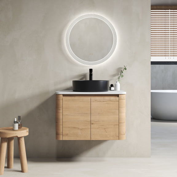Wall-mounted bathroom vanity cabinet in light wood with black vessel sink on white top