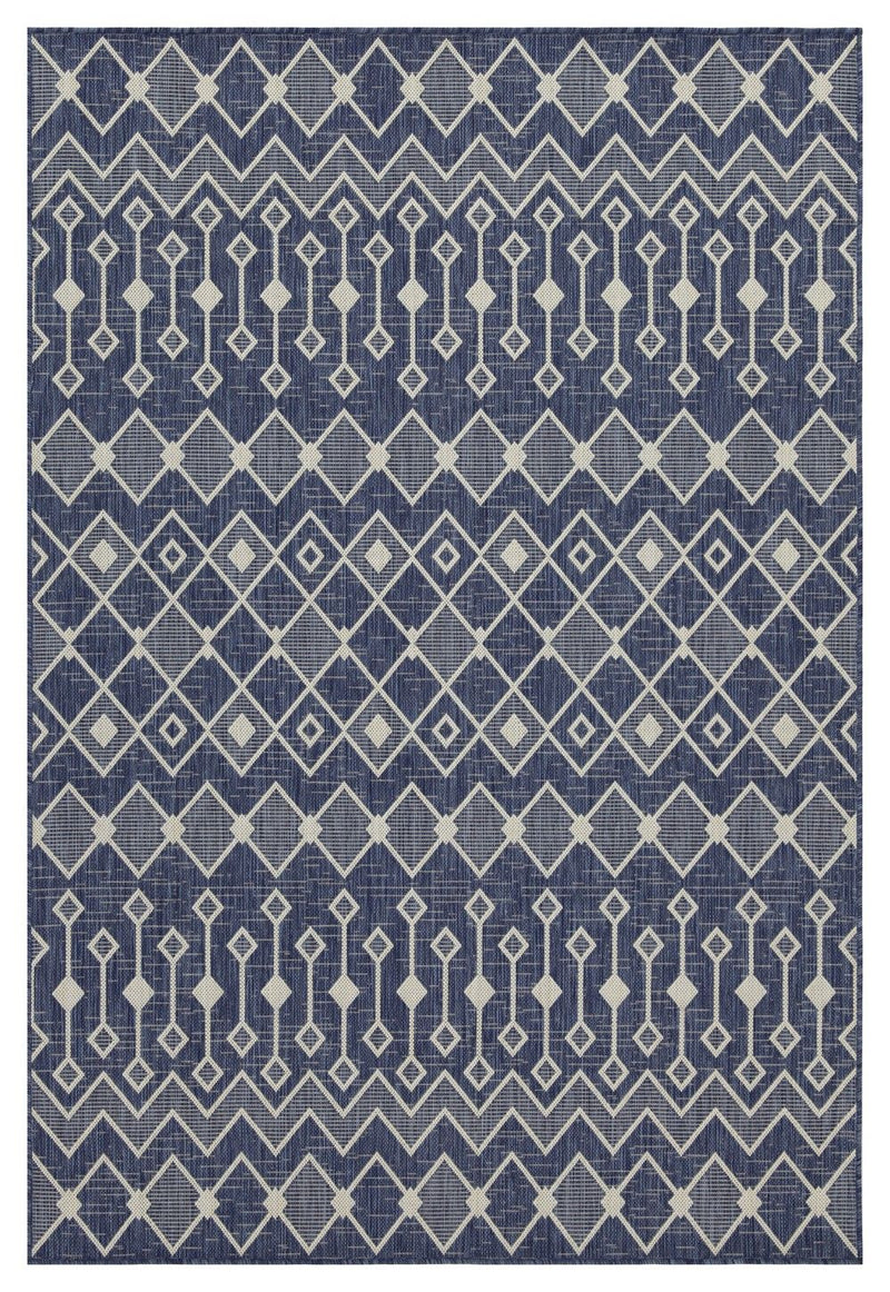 Indoor/outdoor polypropylene area rug, navy with light blue diamond and chevron motifs.