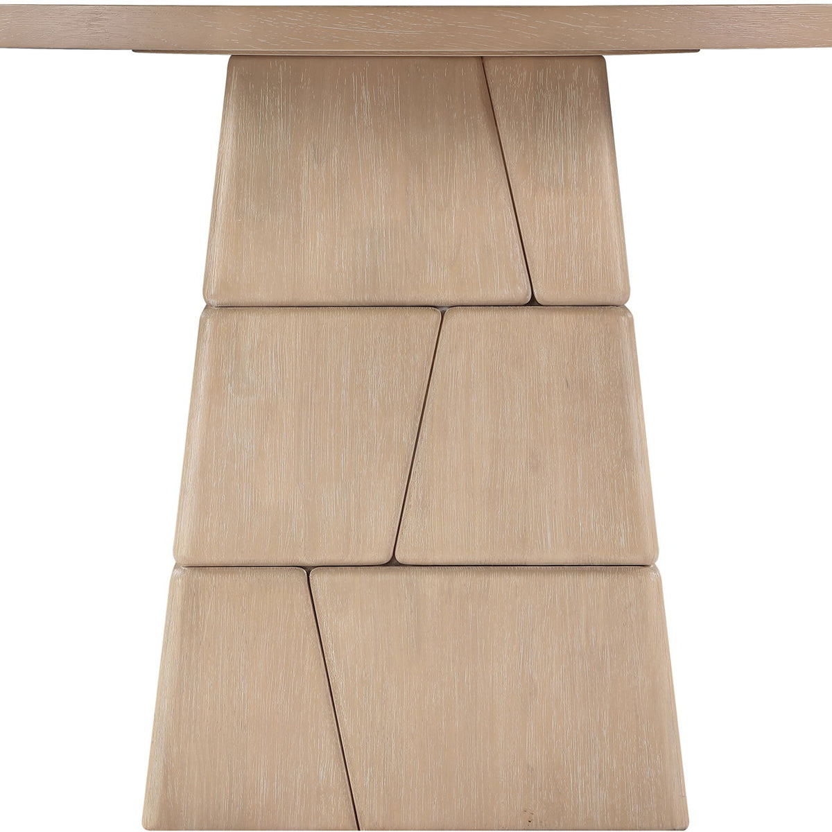 Light brown round dining table with stacked block pedestal base, close-up