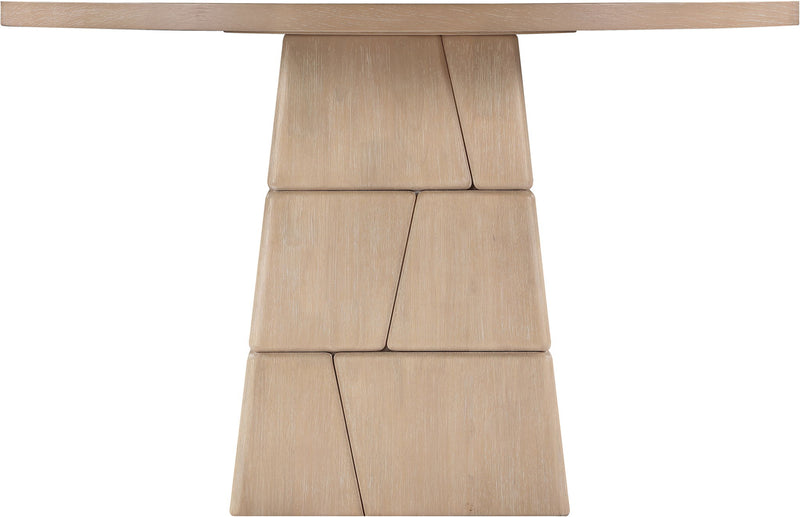 Light brown round dining table with stacked block pedestal base, close-up
