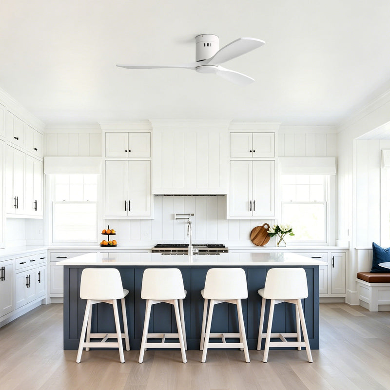 White flush-mount ceiling fan installed in an indoor kitchen ceiling