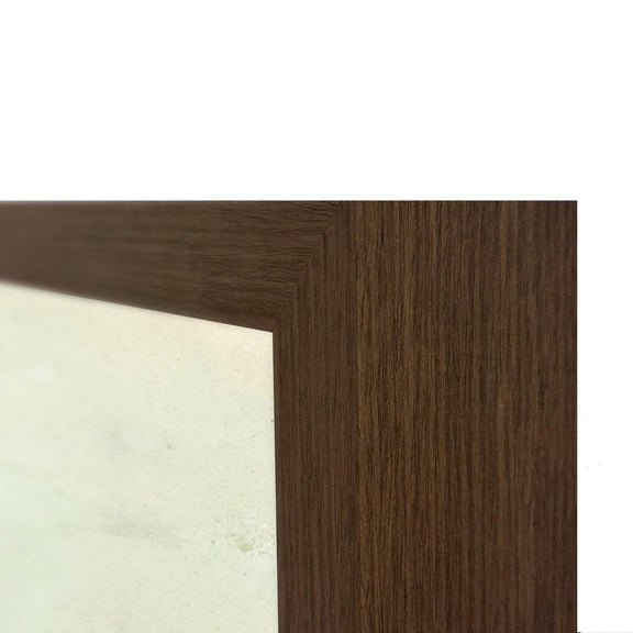 Brown wood picture frame corner with visible grain beside the tree artwork border