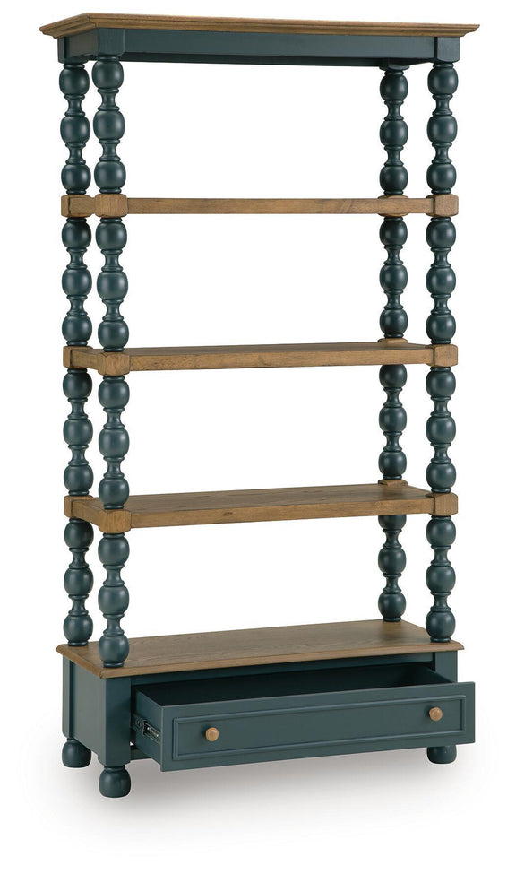 Blue bookcase with three wood shelves, dark turned posts, and a single lower drawer