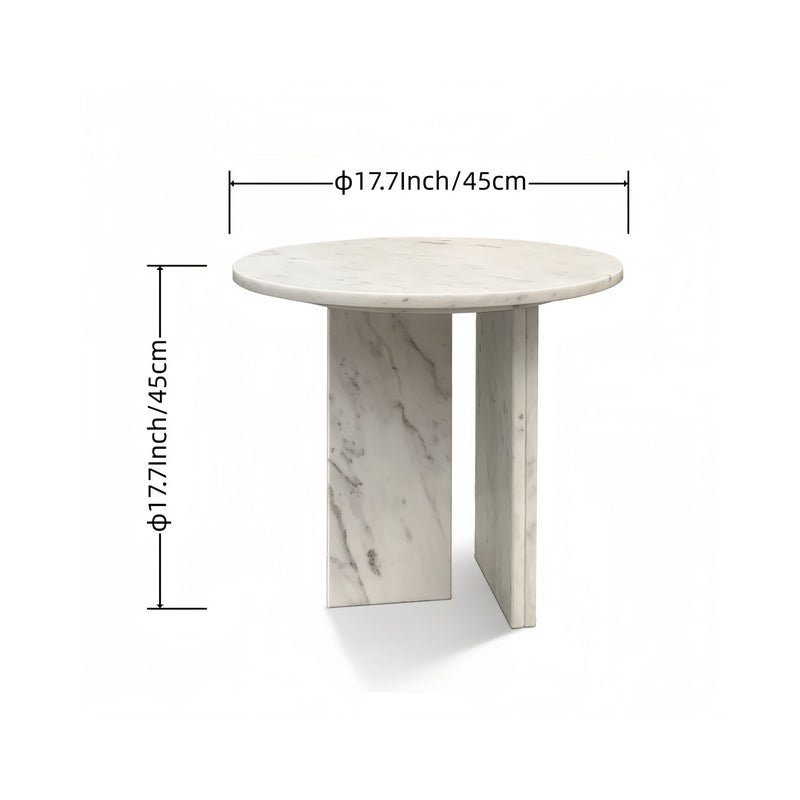 Round marble coffee table with white veining and four square stone legs.