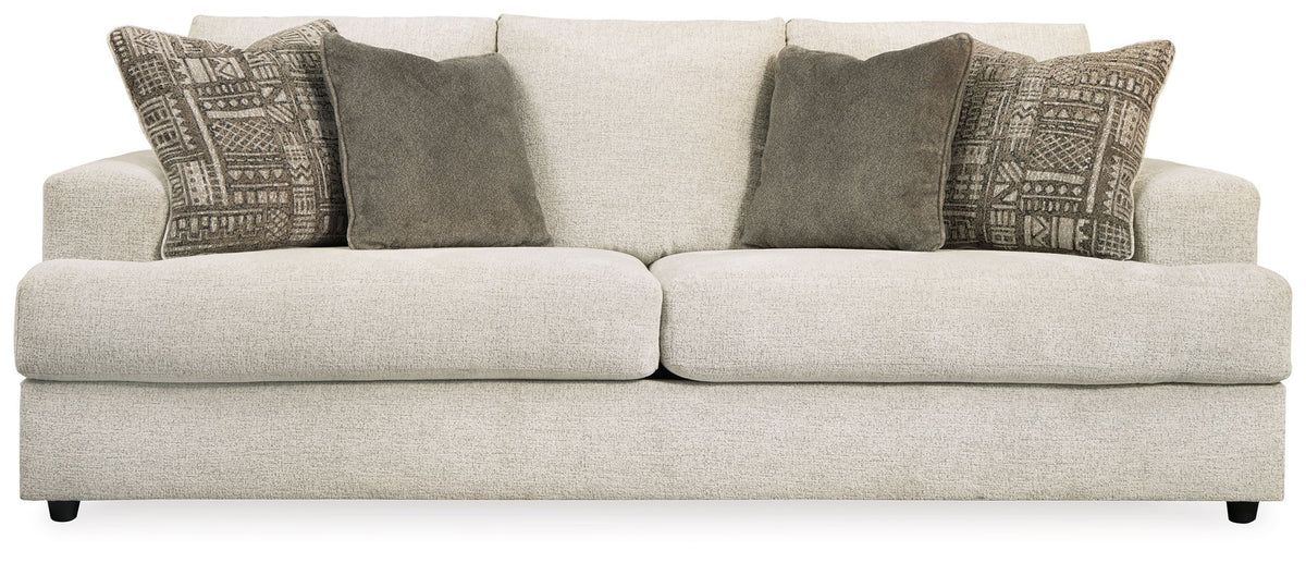 Soletren stone sofa with light beige upholstery and gray patterned accent pillows
