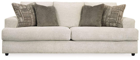 Stone queen-size sofa sleeper with patterned and solid throw pillows