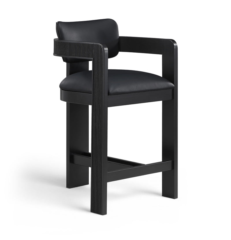Black vegan leather counter stool with padded back, fluted accent and black frame