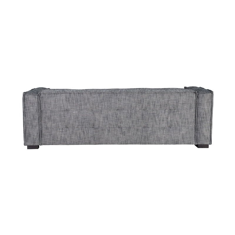 Gray fabric sofa back panel with tufted upholstery and dark wooden legs.