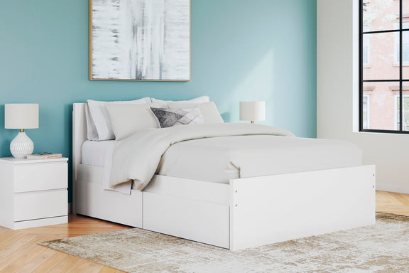 White panel platform bed with headboard, side storage drawers and bedding set