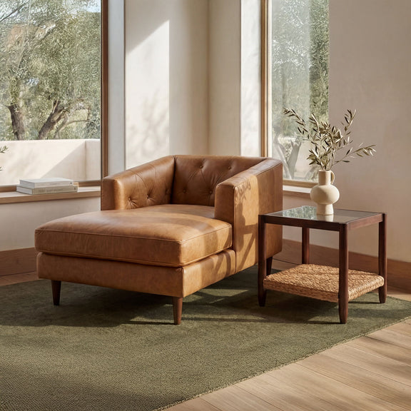 Tan-brown tufted leather chaise chair with square seat and dark wood legs