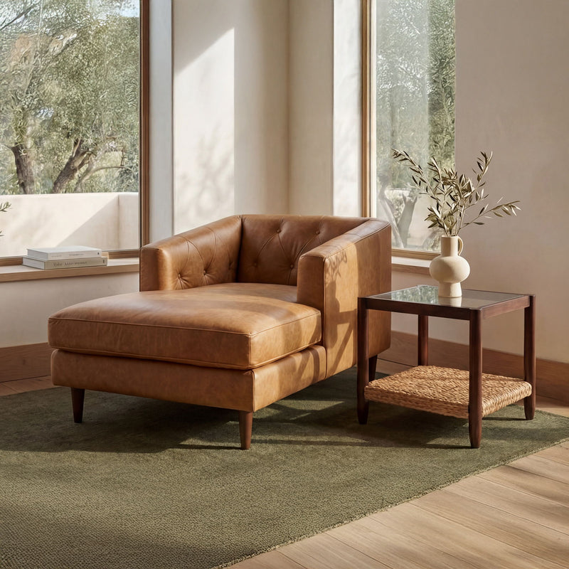 Tan-brown tufted leather chaise chair with square seat and dark wood legs