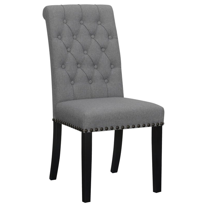 Dark gray tufted rolled backrest side chair with nailhead trim and dark wooden legs