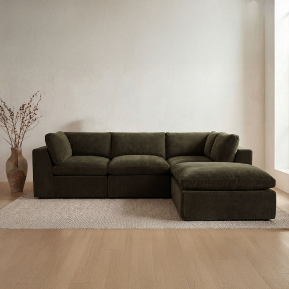 Dark green modular sectional sofa with chaise extension and square seat cushions