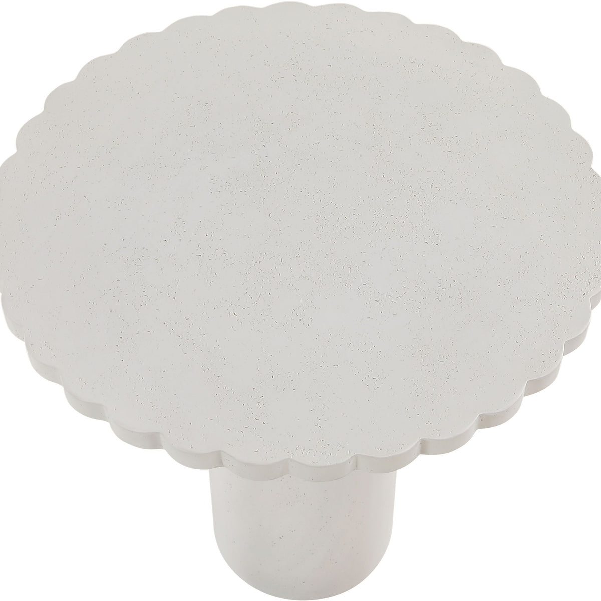Light speckled round tabletop with scalloped edge and short pedestal base